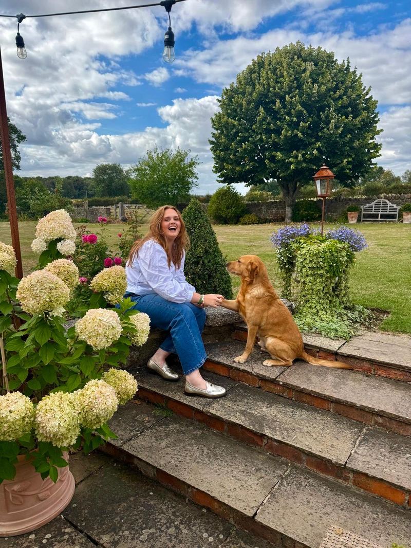 Harriet in the garden with her dog
